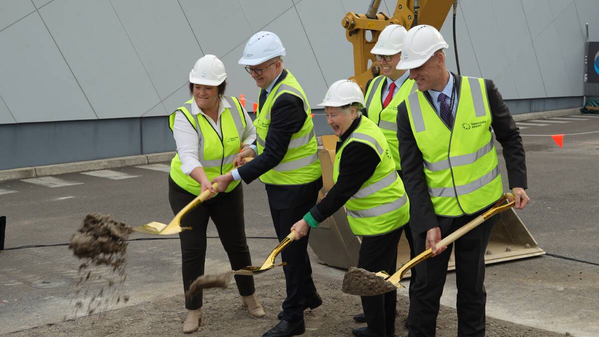 Prime Minister Anthony Albanese turns the first sod on a $110 million terminal expansion at Newcastle Airport. Picture supplied

