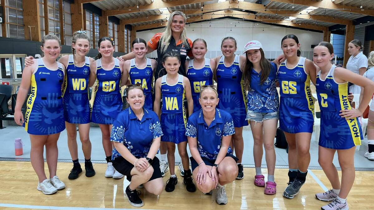 Holy Spirit Primary School Kurri Kurri senior girls' netball team with the Giant's Matilda McDonell at the State Finals. Picture supplied