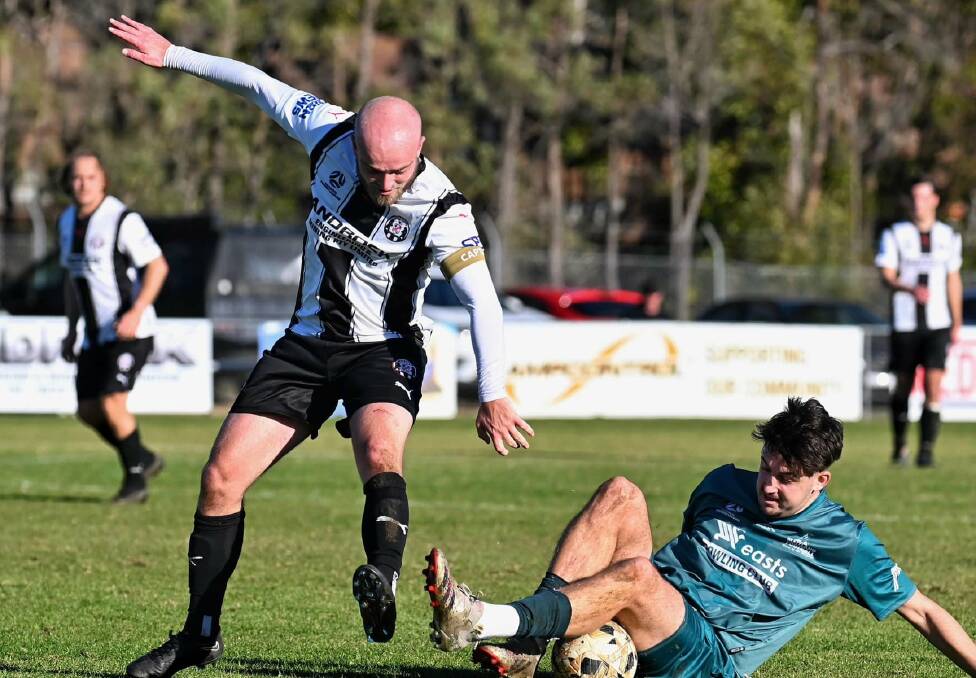 Weston captain Chris Hurley challenges for the ball against Maitland in round 16 of the Northern NSW NPL. Picture by ANFN