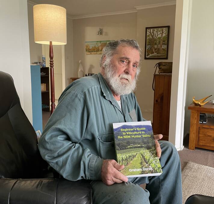 Nulkaba resident Graham Doran with his book, the Beginner's Guide to Viticulture in the NSW Hunter Valley. Picture by Krystal Sellars.