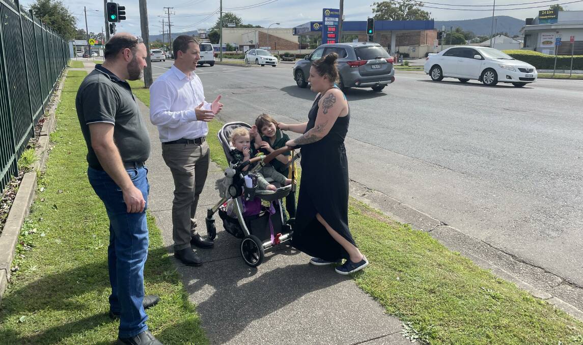 Cessnock councillor James Hawkins and mayor Jay Suvaal discuss traffic concerns with local resident Jessica Harris (with Corey and Sophie) on Wollombi Road. Picture by Krystal Sellars.