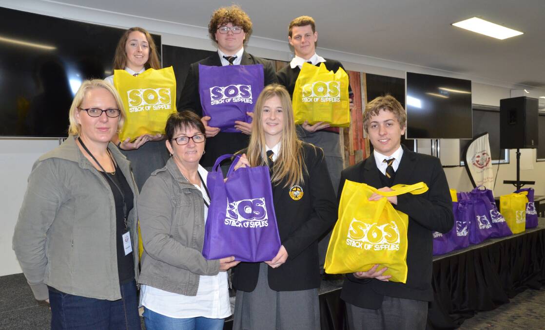 GENEROUS: Pictured at front, Samaritans community services manager Belinda Latimore and senior worker Lesley Radnidge and St Philip's work studies students Maddison Humble and James Martin, and at back, Sarah O'Donnell, Oliver Lorenzen and Jay Guy.
