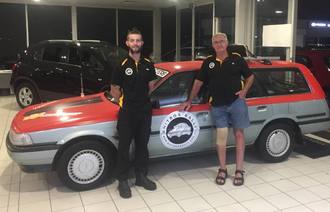 JOURNEY AHEAD: Danny Hawkins and Bob Bedford in front of the 1992 Toyota Camry they will drive from Brisbane to Darwin to raise money for the Cancer Council.