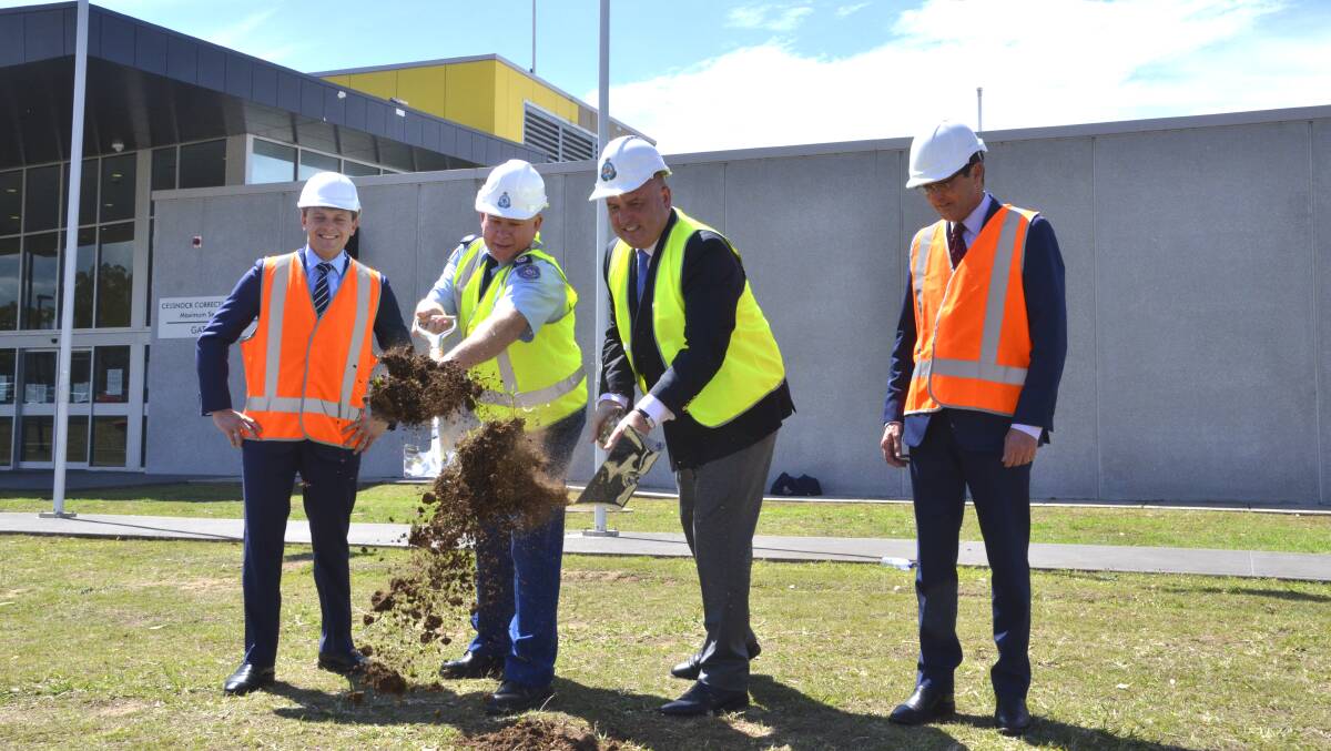 DIGGING IN: Corrective Services NSW northern custodial operations director Glen Scholes and Minister for Corrections David Elliott (flanked by MLC for the Hunter and Central Coast, Taylor Martin and Parliamentary Secretary for the Hunter and Central Coast, Scot MacDonald) turn the first sod for the Cessnock Correctional Centre maximum security section expansion on Wednesday. Picture: Krystal Sellars