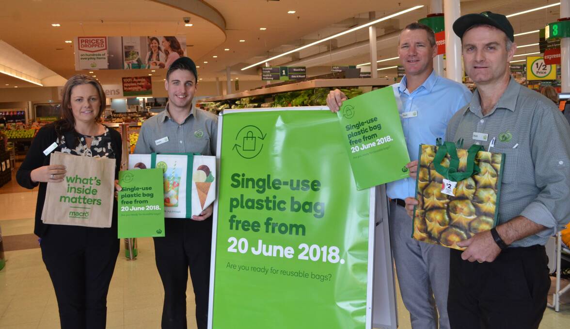 GOING GREENER: Woolworths Cessnock staff Mel Stubbs, Jordan Paterson, Scott Kime and Brett McIntyre with some of the environmentally-friendly bags available in store. The supermarket will go single-use plastic bag-free on June 20.