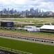 The flood wall at Flemington Racecourse has been criticised in a report following flooding in 2022. (James Ross/AAP PHOTOS)